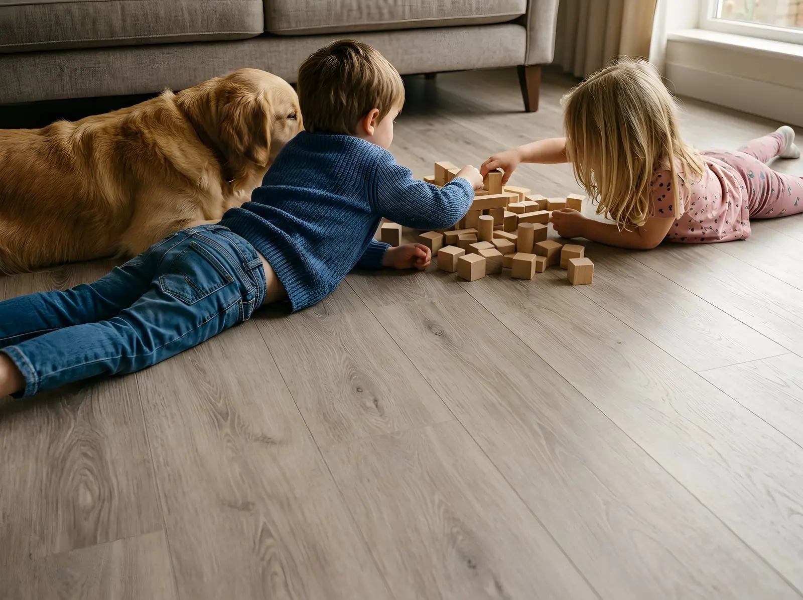 Kids and a golden retriever playing on laminate flooring